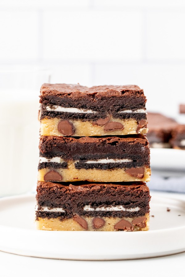 Stack of three slutty brownies on a plate