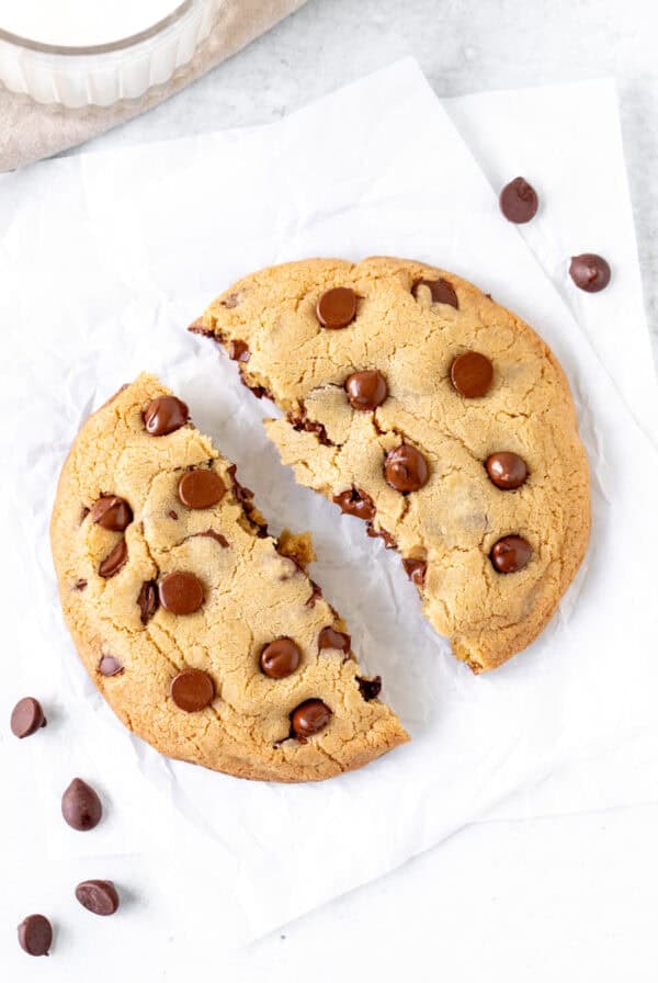 Giant chocolate chip cookie broken in half