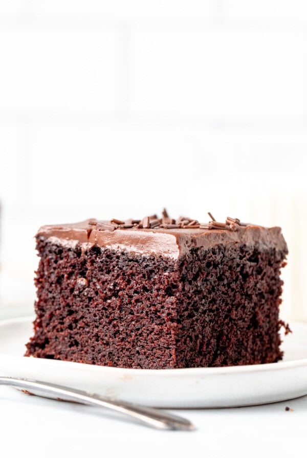 Slice of moist chocolate cake with chocolate frosting