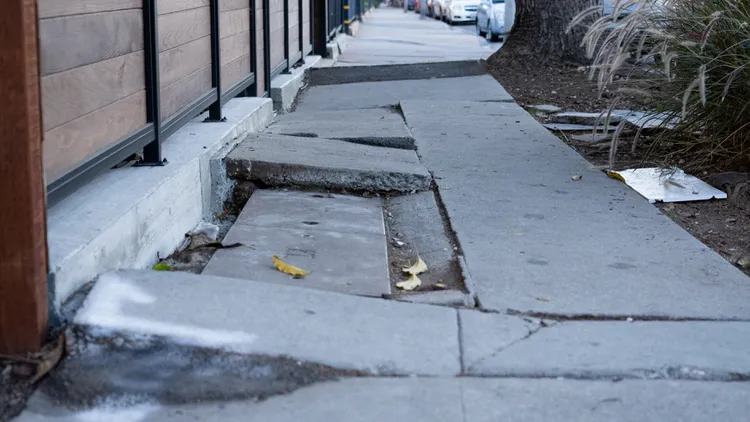 LA spends tens of millions of dollars settling sidewalk injury lawsuits each year. But the city says that actually fixing the sidewalks would cost more.