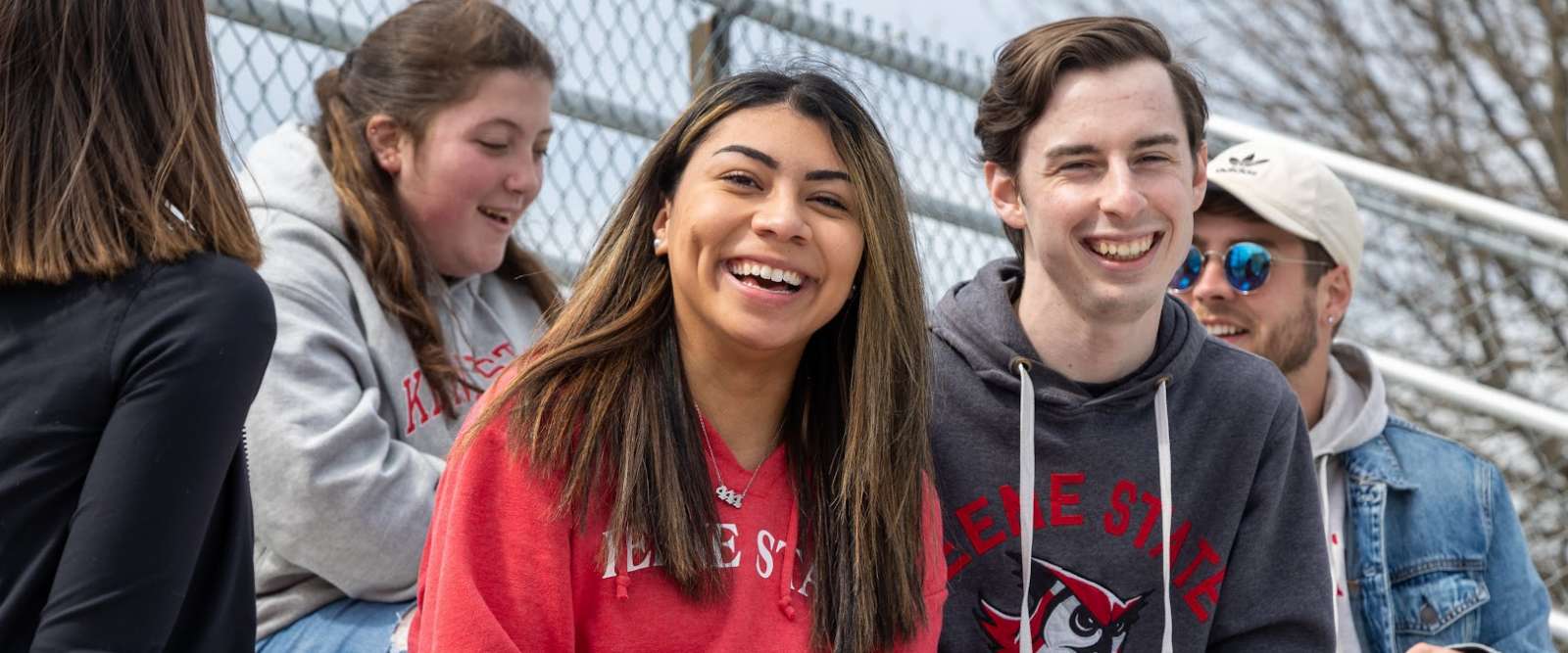 Students enjoy a game in the stands at Owl Athletic Complex