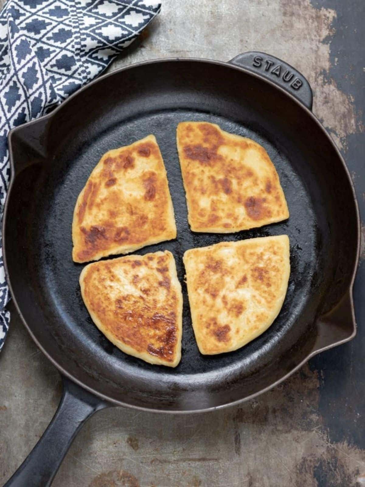 Potato farls in cast iron skillet.