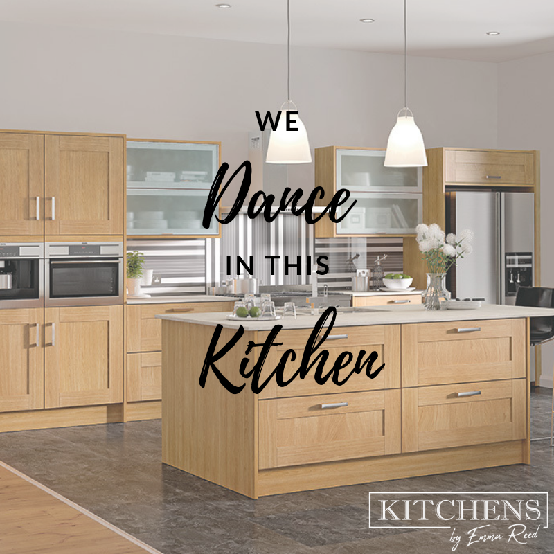 A kitchen with wood cabinets