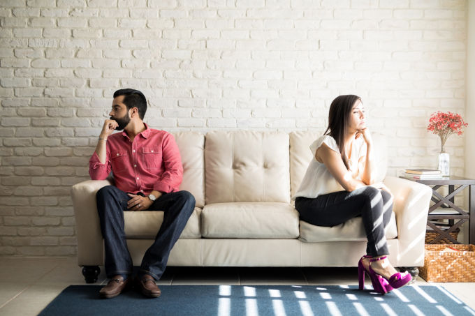 Annoyed couple ignoring each other