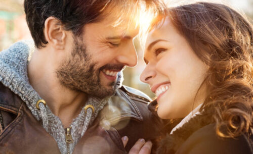 Loving couple outdoors smiling