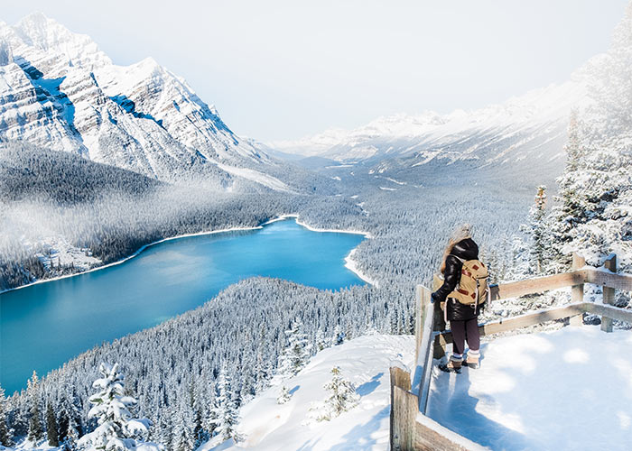 Women at lookout overlooking Peyto Lake on a winter day