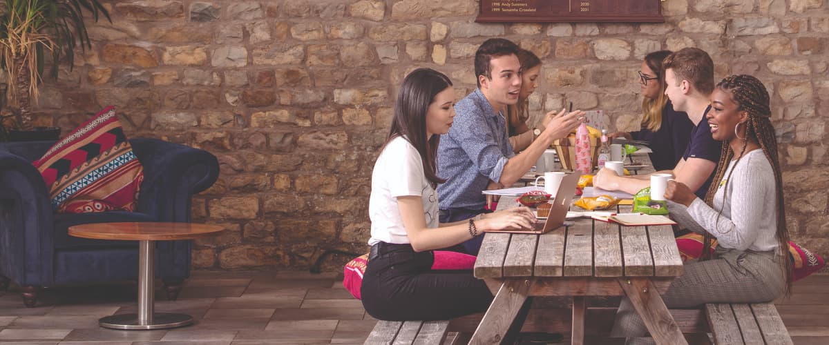 Students at a bench in Barker House Farm