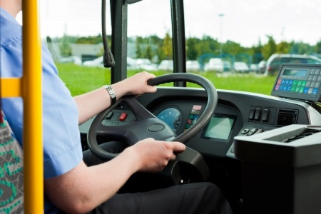 Man Driving School Bus Outside