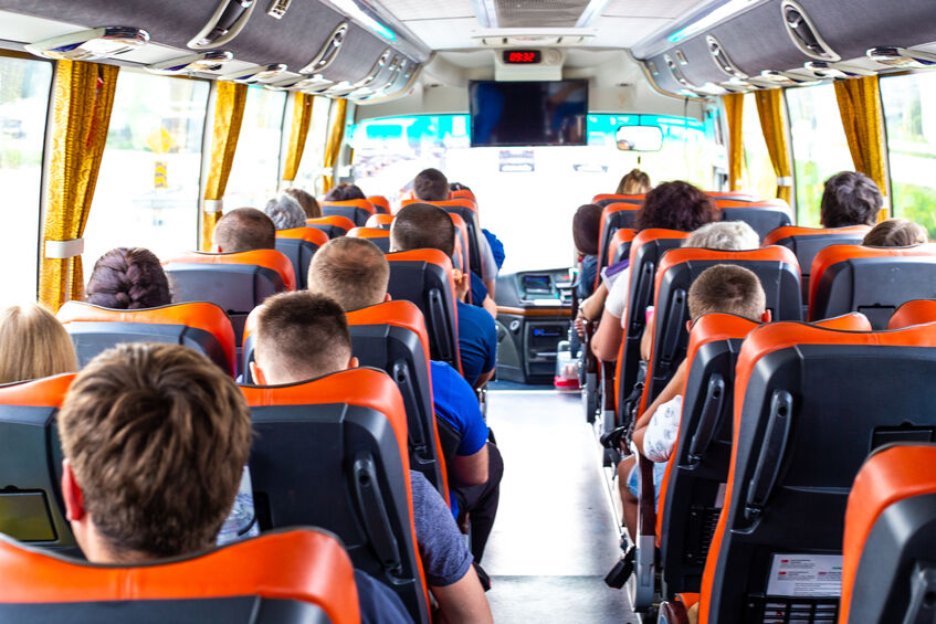 workers traveling by bus to corporate event