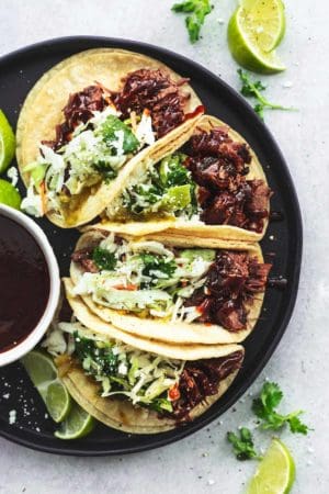 overhead plate of tacos with beef brisket and slaw