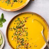 overhead view of two bowls of curried butternut squash soup