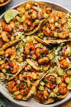 cilantro lime shrimp in taco shells with pineapple salsa