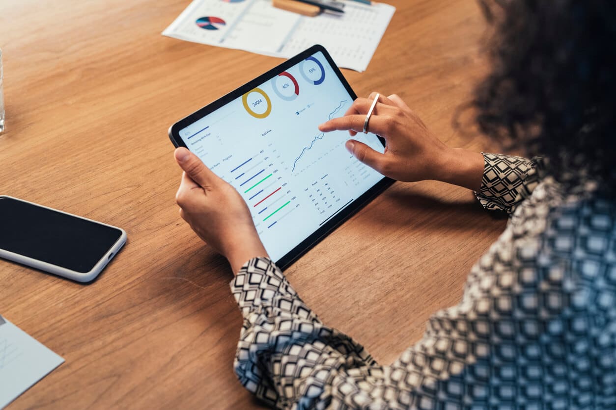 Woman checking on a financial analysis on a tablet