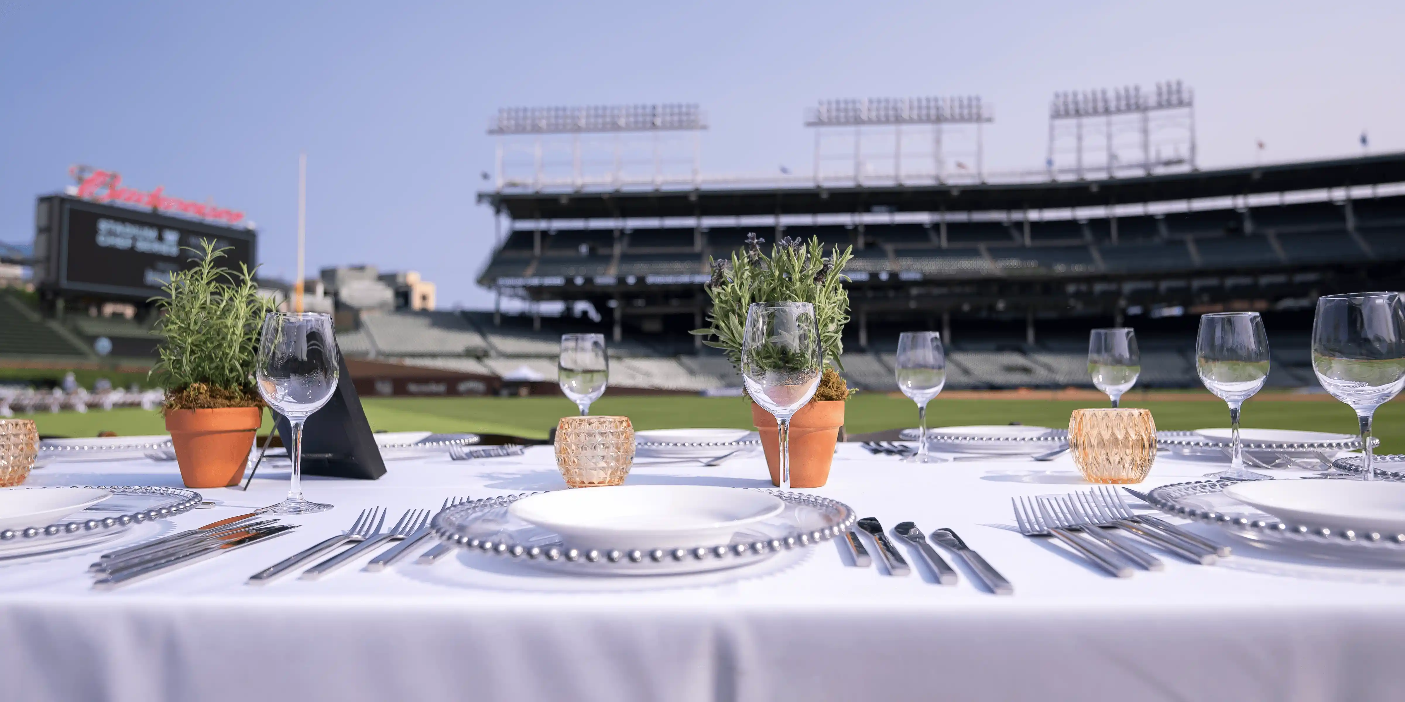 A long banquet table set up on Wrigley Field - Desktop Version