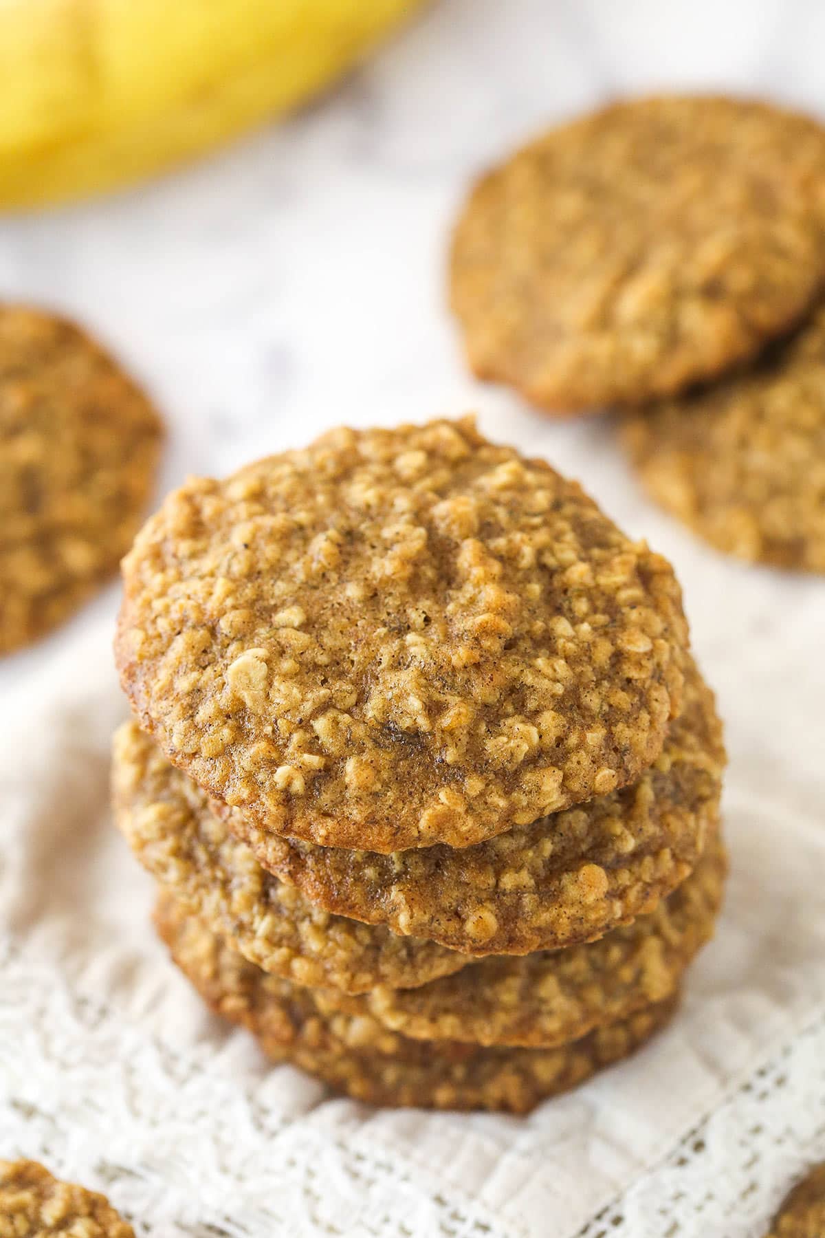 Top view of 6 Moist and Chewy Banana Oatmeal Cookies stacked one on top of the other.