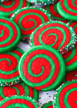 A pile of Christmas pinwheel cookies on a plate