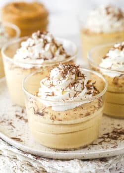 Glasses of peanut butter mousse topped with whipped cream