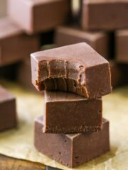 A stack of 3 pieces of chocolate fudge