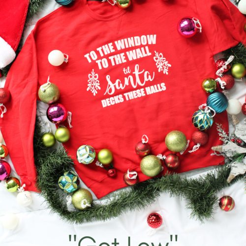 "To the Window, to the Wall, 'Til Santa Decks these Halls" Christmas parody sweatshirt that you can DIY! All you need is a Cricut, vinyl, screen printing supplies, and a sweatshirt to make this hilarious holiday sweater.