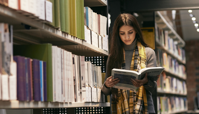 A student reading in the library