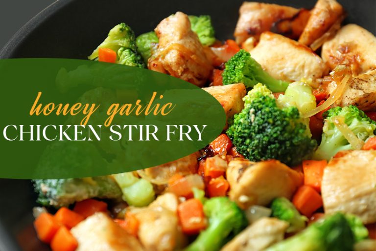 Pan of chicken, garlic and carrot stir fry in a honey garlic sauce