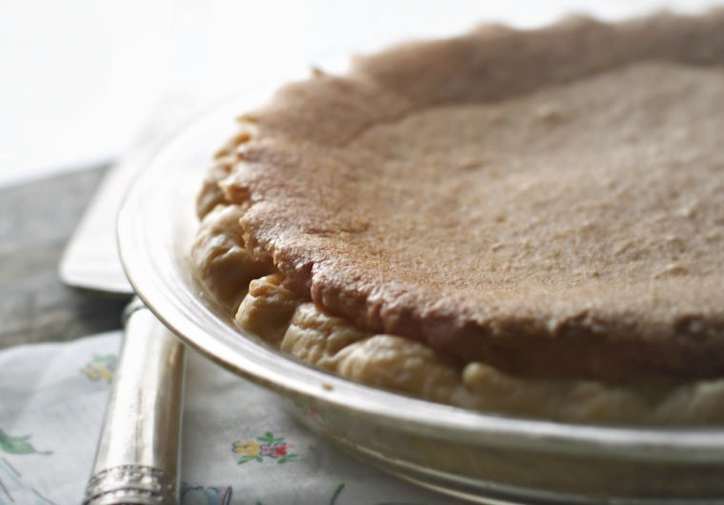 the edge of a chess pie with morning light glistening on the edge. 