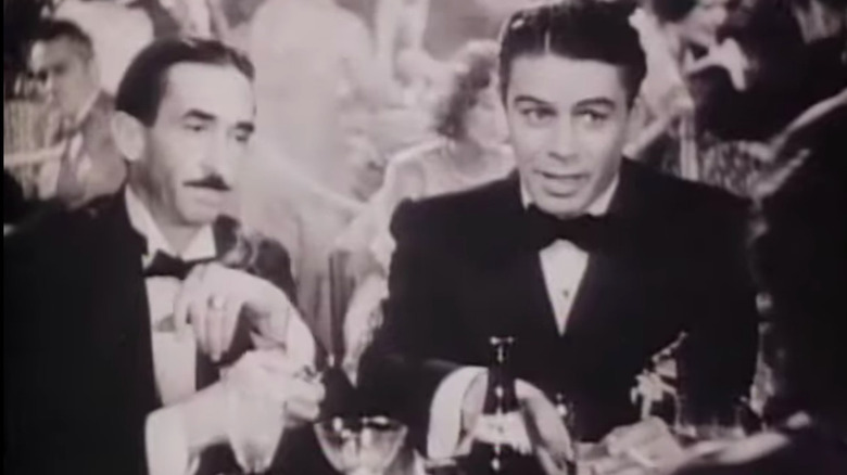 Paul Muni speaking at a restaurant