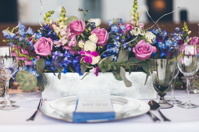 purple, blue, white, mauve and green floral bouquet centerpiece 