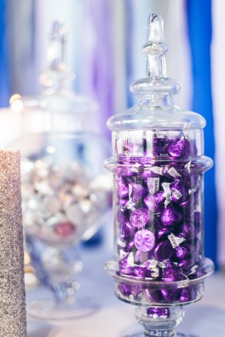 apothecary jar filled with purple Hershey kisses 