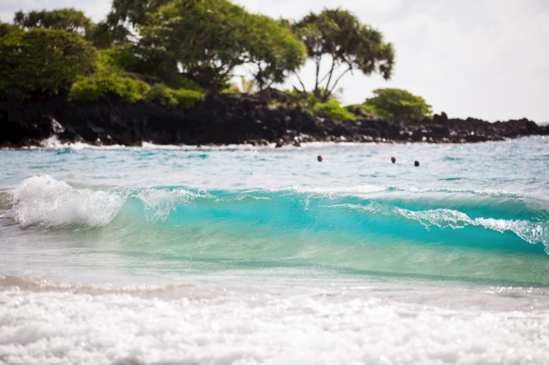 Wave crashing on shore of Hamoa Beach