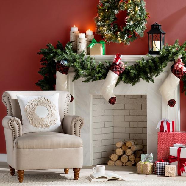 Festive Fireplace Mantels Decorated with Christmas Lights and Candles