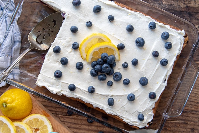 an overhead shot of a whole lemon blueberry sheet cake