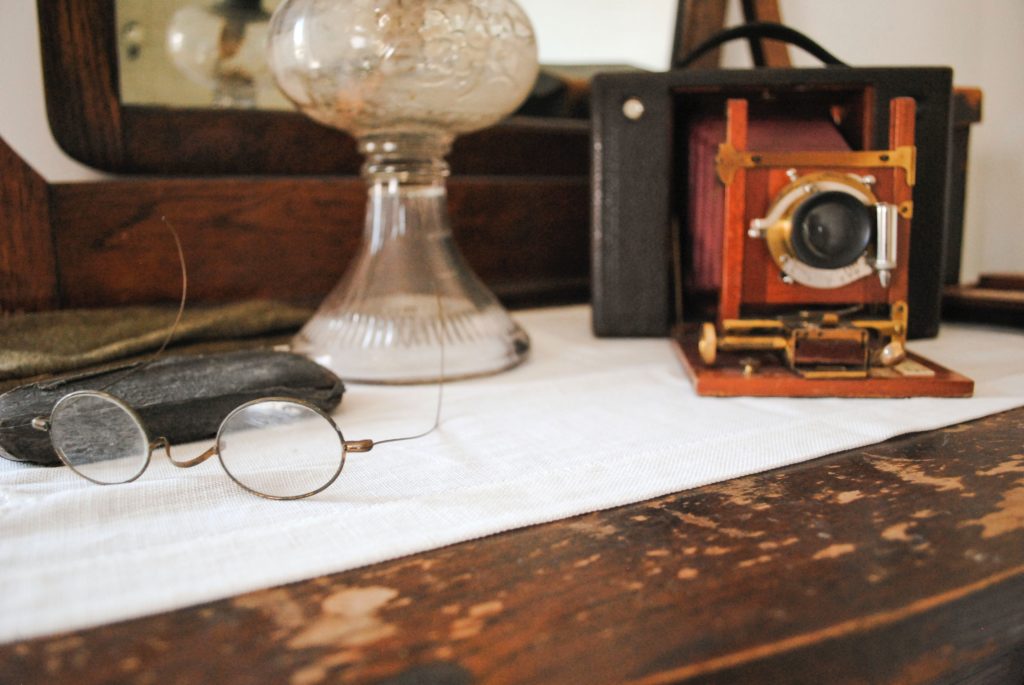 worn down dresser with antique items on top