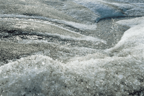 Sand and grit on ice.