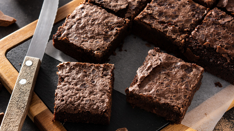 Square chocolate brownies with knife