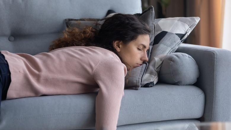 Woman napping on couch