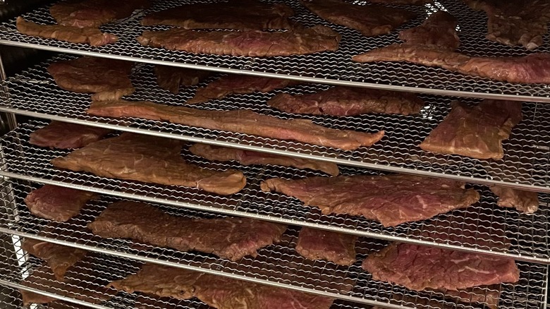 Beef jerky drying on racks 