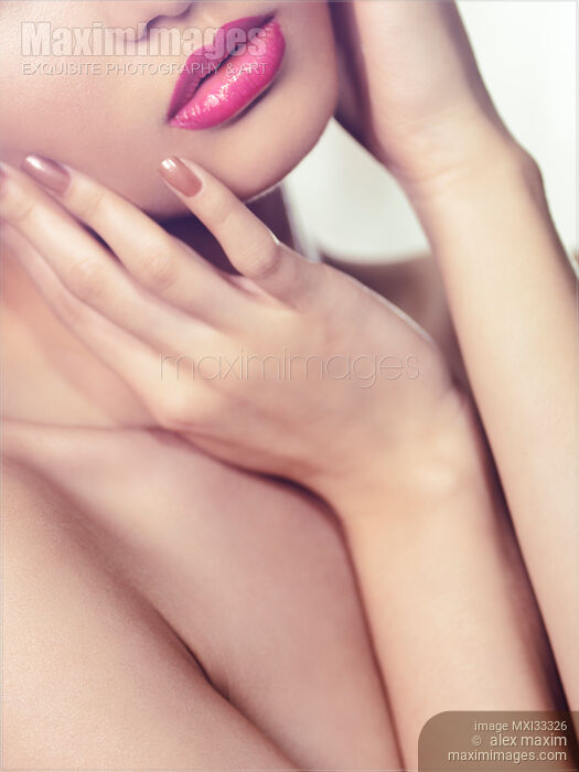 Beauty face closeup of sensual woman mouth with pink lipstick Stock Image MXI33326 © Alex Maxim / MaximImages