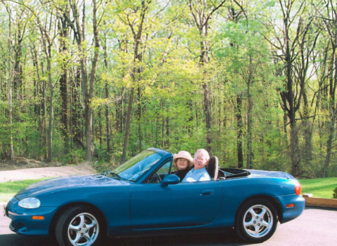 John Ketwig and Wife in a Mazda MX-5 Miata