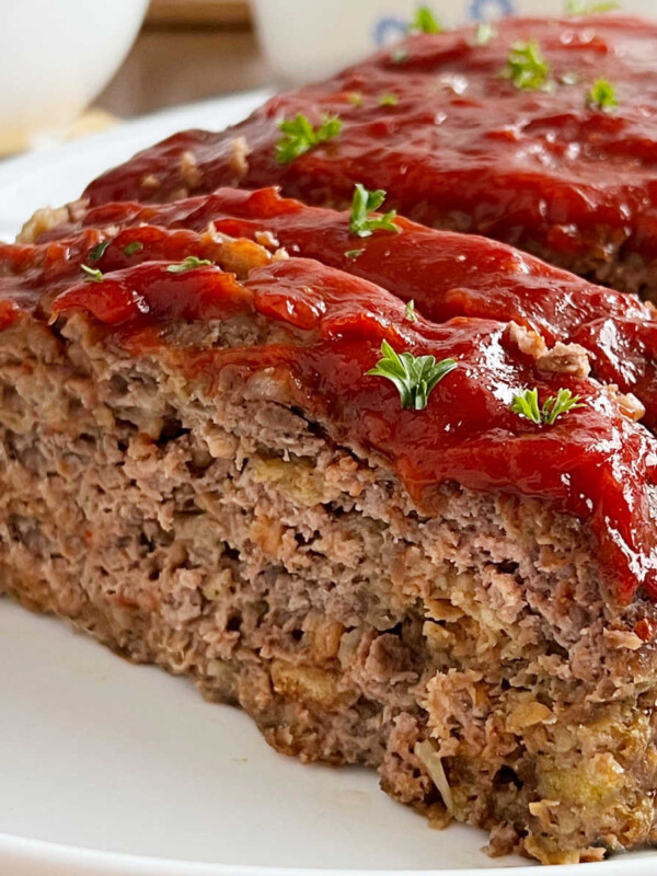 stove top stuffing meatloaf with ketchup glaze sliced on platter.