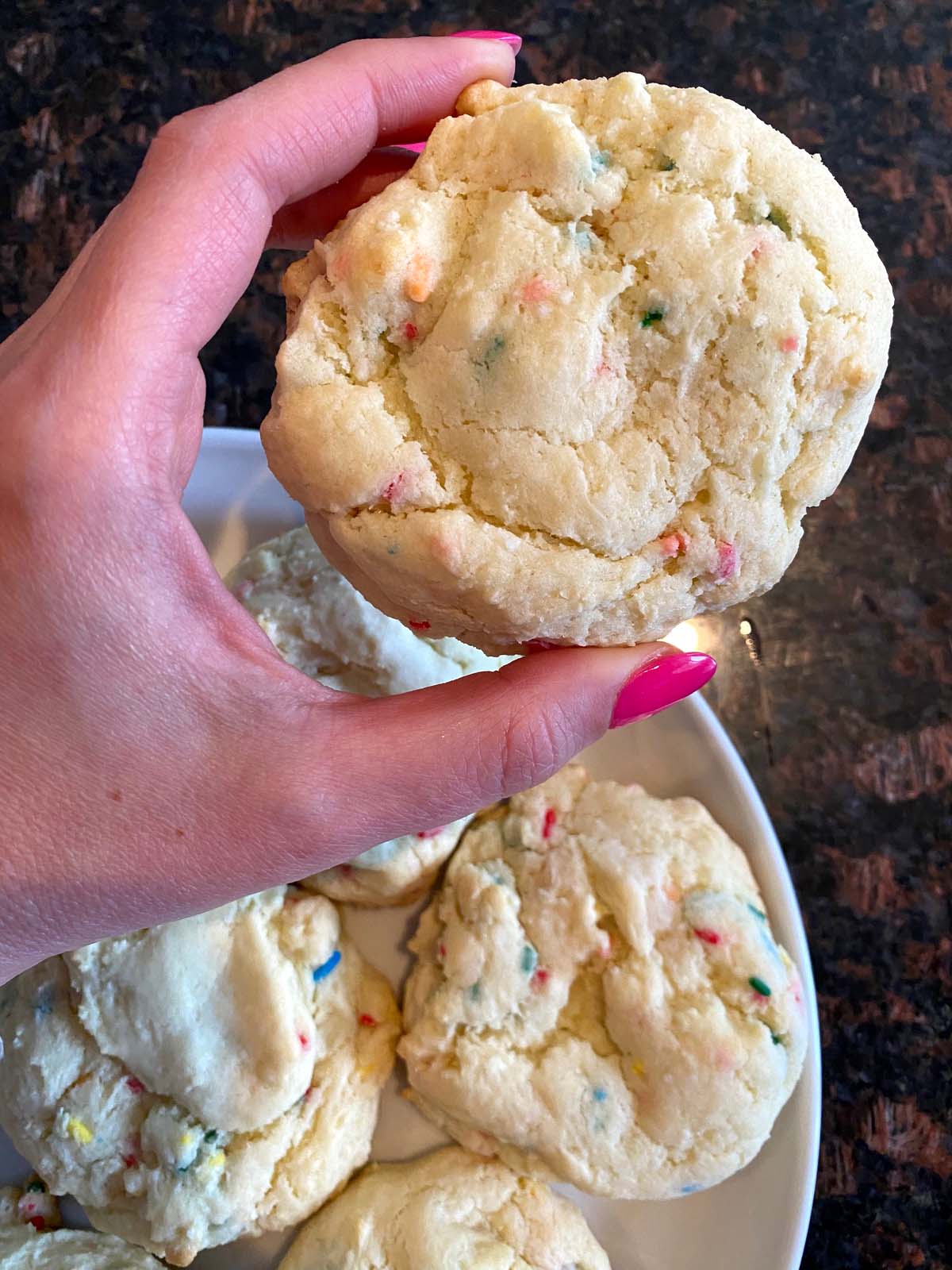 Funfetti cake mix cookies on a white plate.