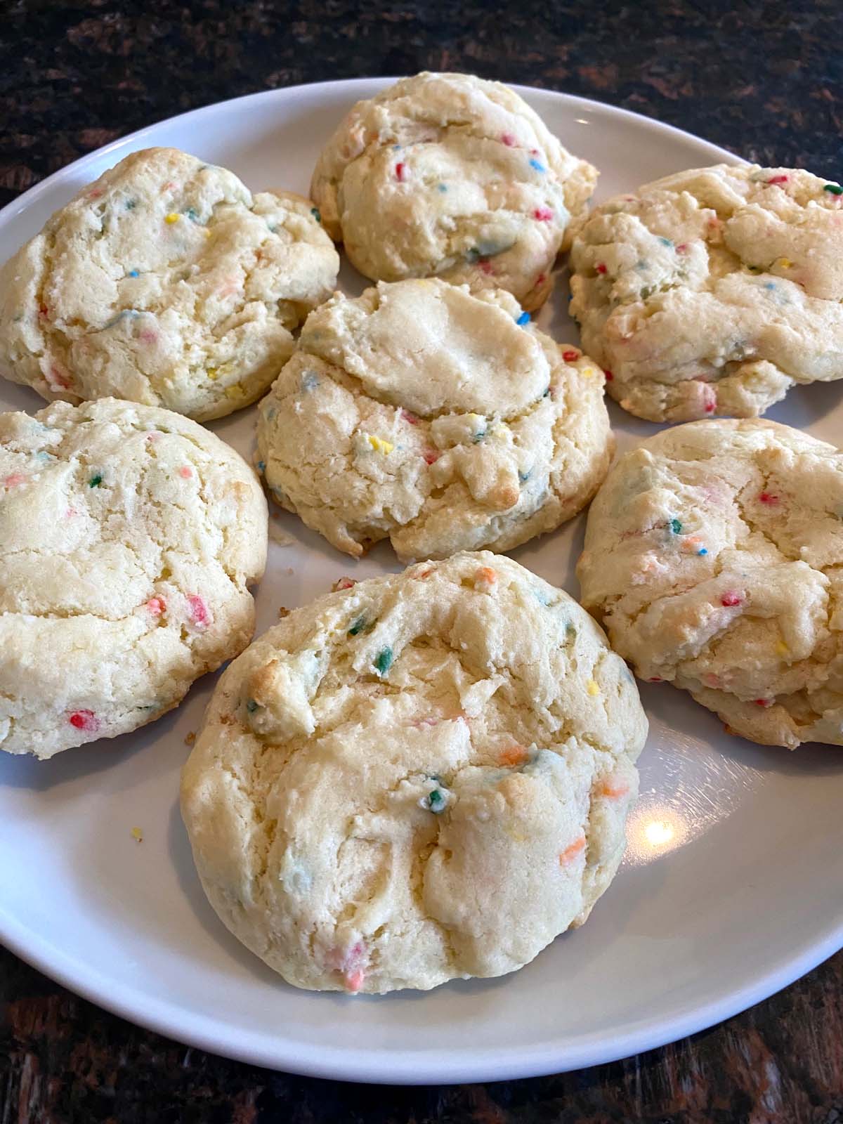 Funfetti cake mix cookies on a white plate.