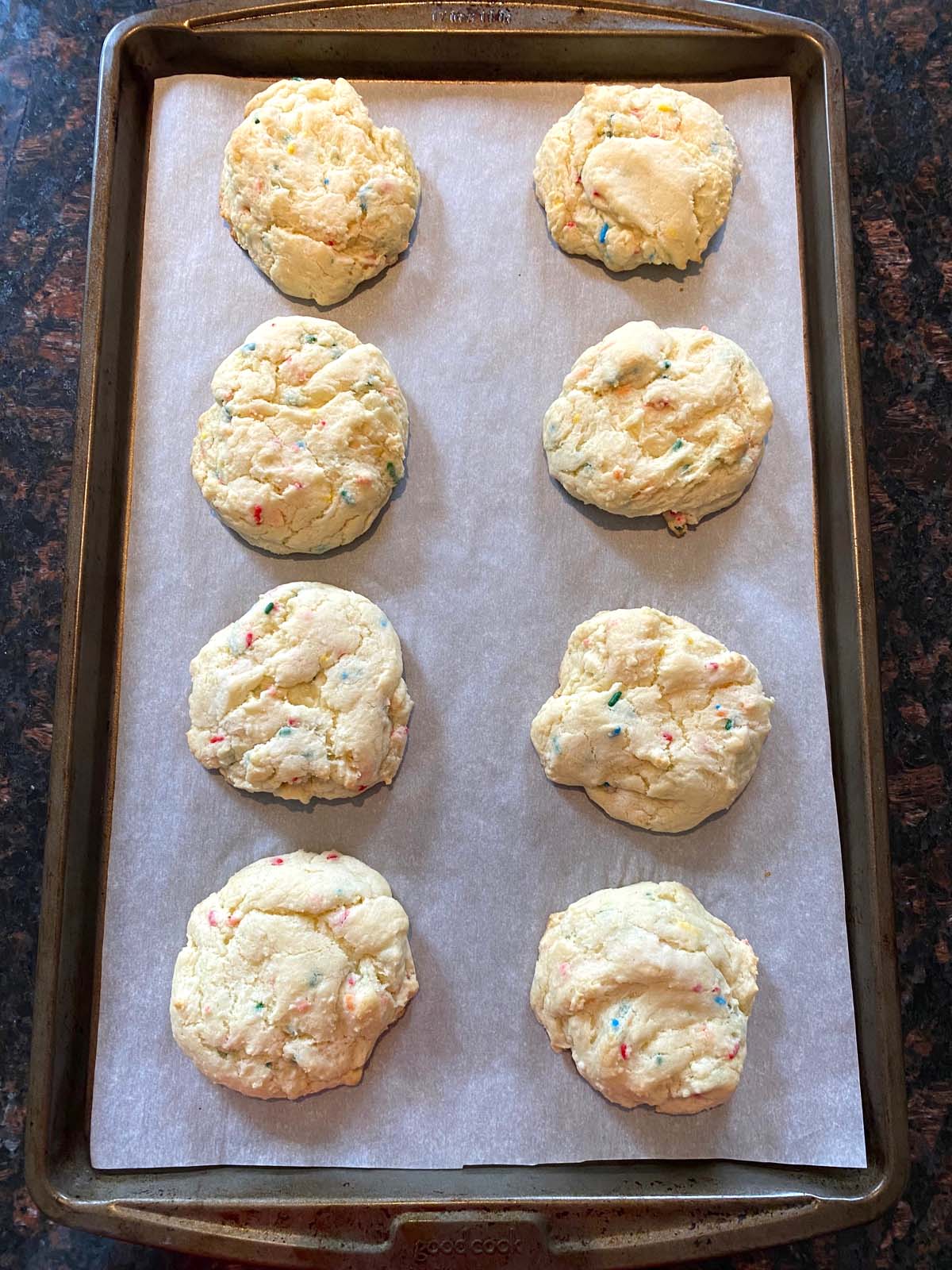 Funfetti cake mix cookies on a sheet pan.