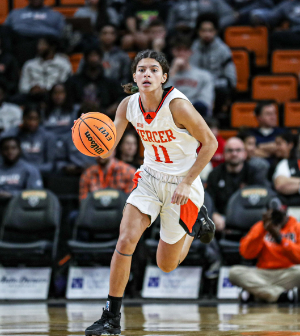 women's basketball player dribbles the ball