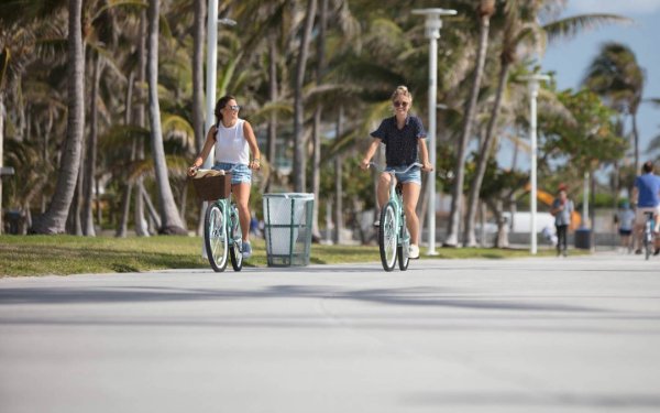 Women bicycling around Miami Beach