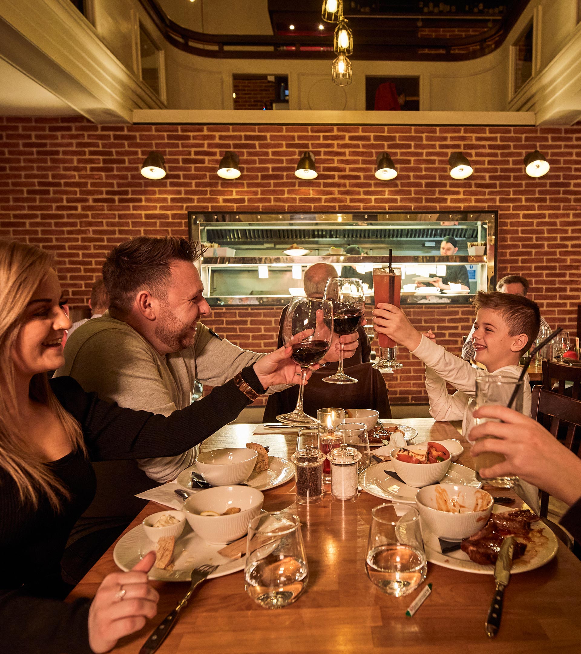 A happy family saying cheers.