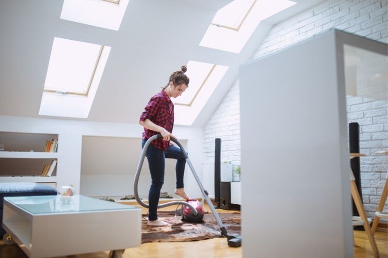 woman cleaning out rental home