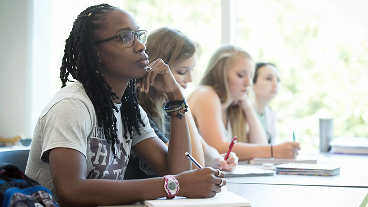 Students listening attentively within the classroom