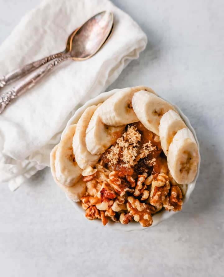 Banana Walnut Brown Sugar Oatmeal. How to make creamy oatmeal with your favorite toppings combinations. I am sharing a list of all of the popular oatmeal toppings ideas to serve on a cold winter day and how to make the best bowl of oatmeal!