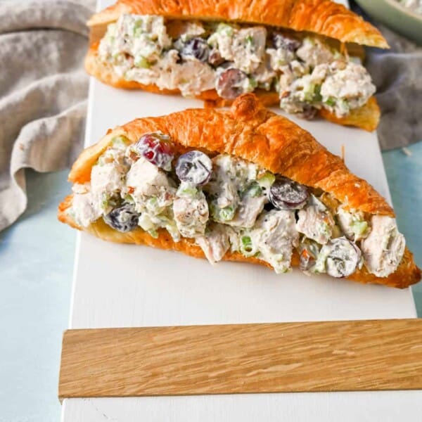 Creamy Homemade Chicken Salad made with tender chicken, crunchy celery, green onion, sweet grapes, and crunchy almonds in a mayonnaise dressing. This is a classic chicken salad recipe that everyone loves and is perfect for a quick lunch or potluck.